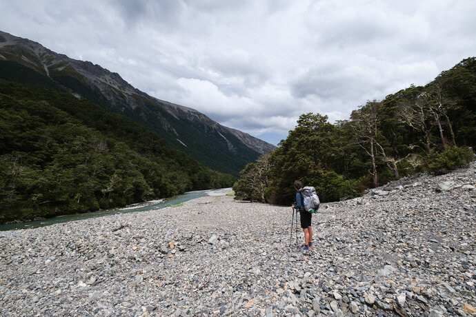 Hiker standing near the riverbed of Waiau River