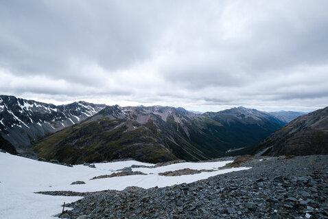 View of mountains, snowfields and the Waiau Valley as seen from Waiau Pass