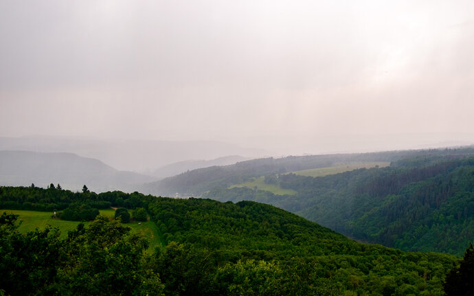 Incoming rain on a hilly landscape in the Soonwald